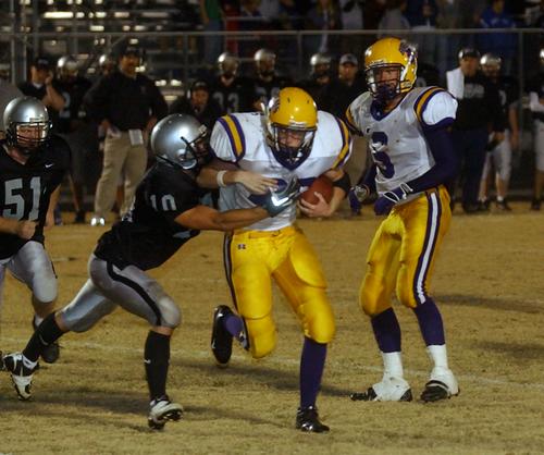 OS RB Lynn Haynes tries to shed a tackle.
