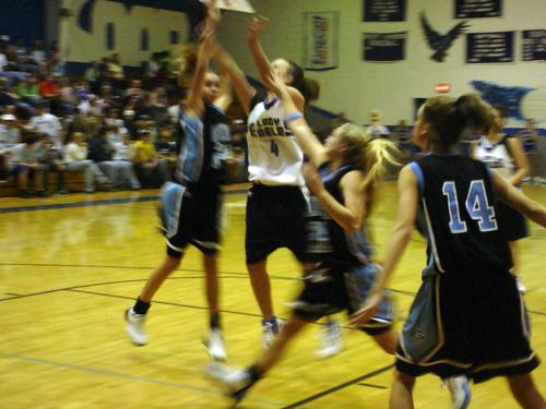 Stevie Gorrell (white 4) stretches for a shot