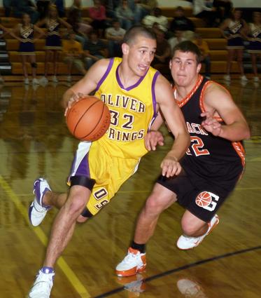 Cody West drives for the basket beating a defender