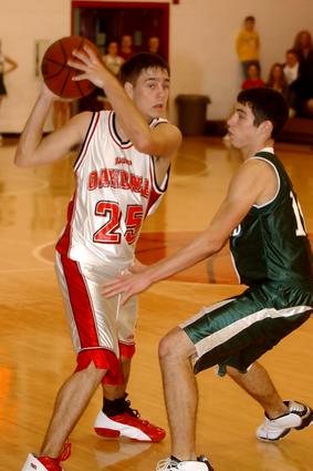 Rockwood's David Butler guards Oakdale's Brandon Helton.