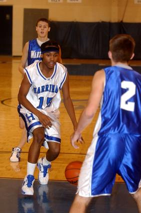 Harriman's Shawn Williams drives the lane against Wartburg.