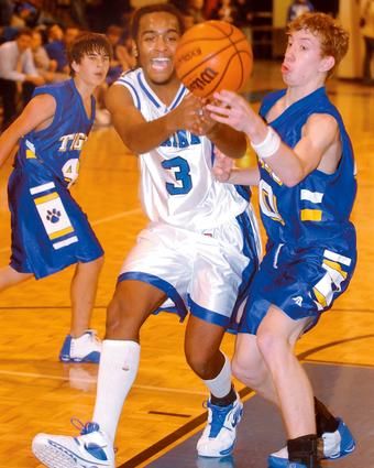 Harriman's Julian Goins battles Sunbright's Shane Kreis for a loose ball.