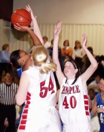 Tennessee Temple's Danielle Rector blocks a Marrisa Thompson shot Thursday night. GPS held on for a 46-41 win. Danielle Rector scored 29 points for Temple. Rector, a sophomore, scored her 1,000 point during the first half of the game.