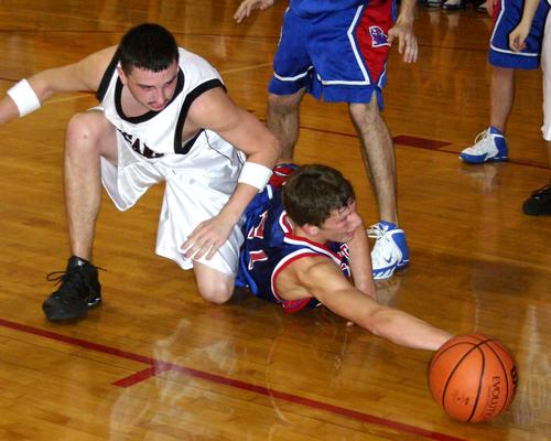 Cougar Tyler Owen battles for a loose ball in the first half.