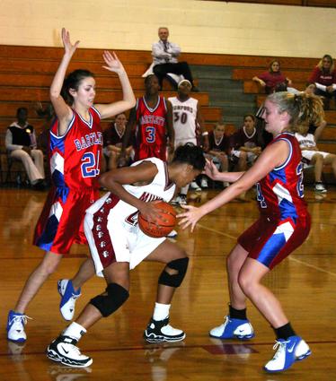 Munford's Whitney Malone is double-teamed by Bartlett.