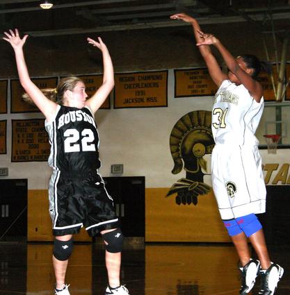 Courtney Jordan shoots a three-pointer.
