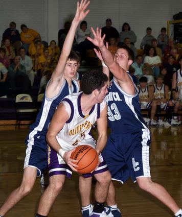 Adam Carter looks for relief from defensive pressure