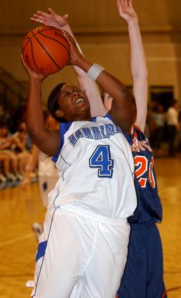 Harriman's Ashley Fuqua powers up a lay-up.