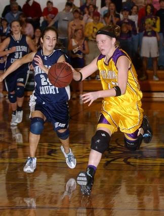 oliver Springs' Jessie Hackworth heads toward the hoop after making a steal.