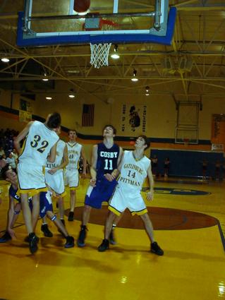 Timmy Blakely (blue 11) fights for a rebound