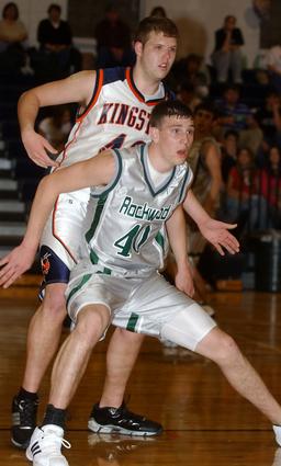 Kingston's Matt Poole defends Rockwood's Jamie Hackler in the post.