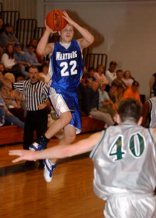 jeremy Shannon throws one up at the halftime buzzer.