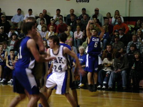 Jared Young (blue 5) shoots from the arch