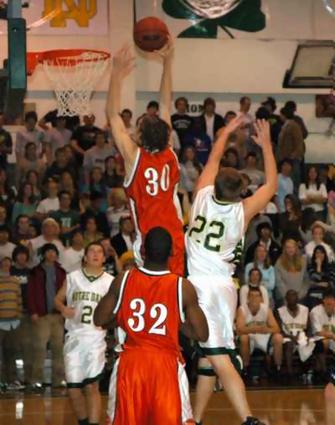 Alex Wells going up for a dunk