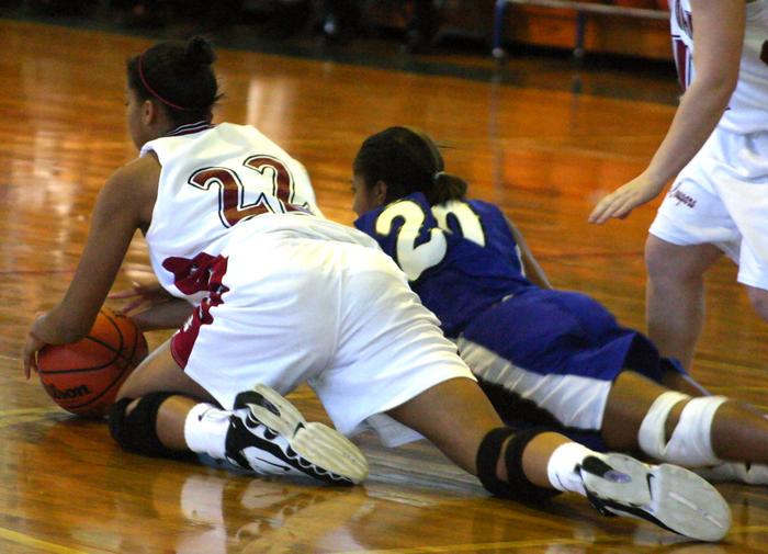 Lady Cougar Whitney Malone dives for a loose ball.