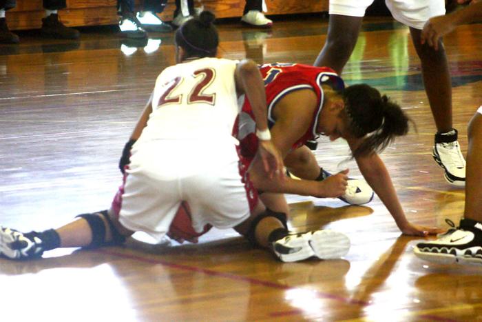Malone and Herring battle for a loose ball.