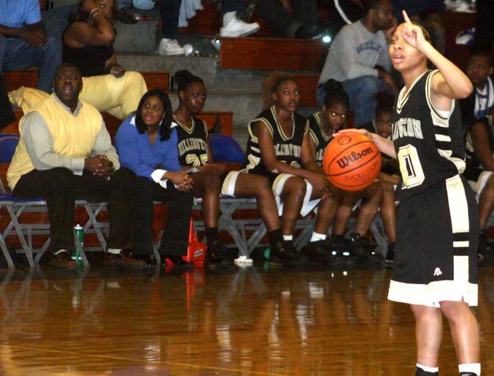 The freshmen runs the point as Coach Stan Gatlin addes a few more instructions.