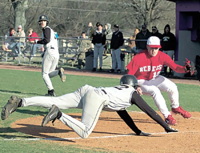 Drew Hayes tags the runner at home