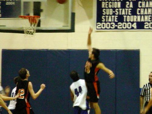 Kelvin Rone (white 44) plays defense