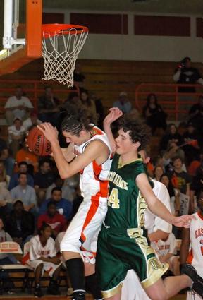 East Ridge's Alex Wells comes down with a rebound Friday night in their district matchup with Notre Dame