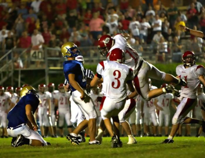 Kevin Loudermilk and holder Matt Hayes watch the game winner sail towards Granny White Park.