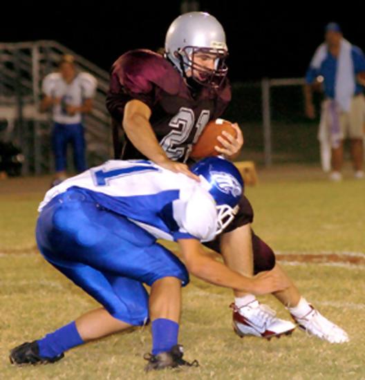 09/15/06 Liberty's #21 Cory Pittman escapes an attempted tackle of Chester County's #11 Eric Yelverton before being tackled several yards down the field during their home game Friday evening.