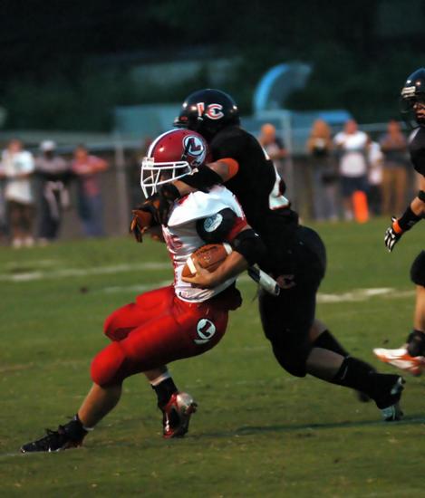 Andrew White making a tackle