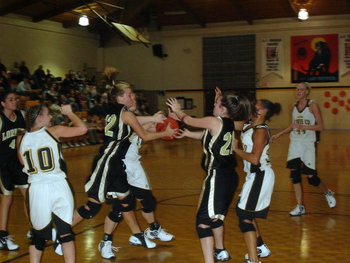 Leah Stone Tries To Get The Ball To Jessica Green