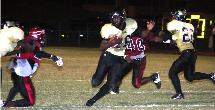 Travis Simpson picks up big yardage for Trojans.