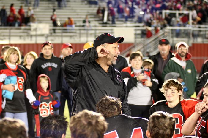 Coach Price looks tired as he talks with the troops