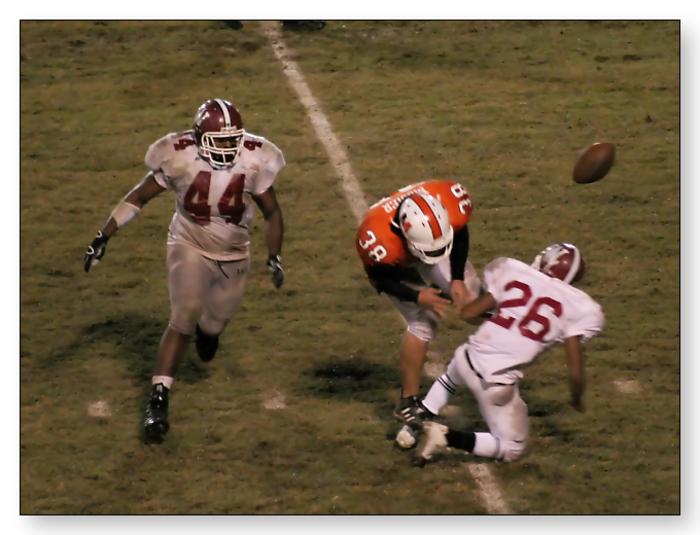 Tell Fanney knocks the ball out to break up the play