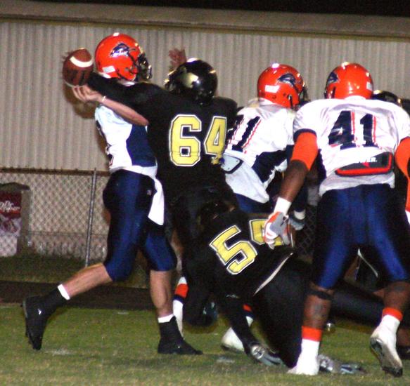 Jerrod Love (54) and Terrance Wilmer (64) cause an interception with pressure.