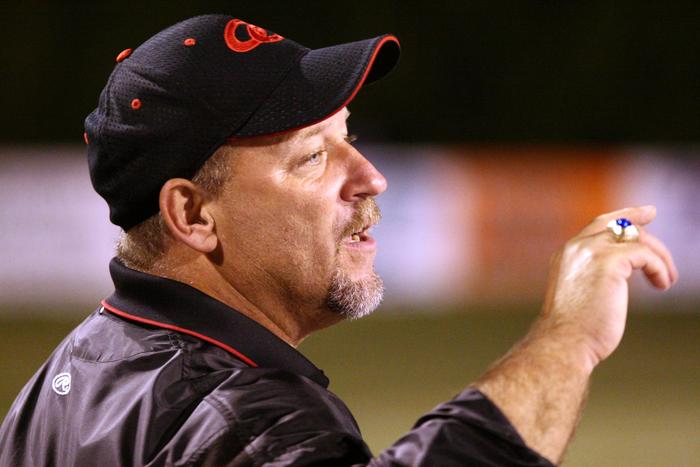 Coach Bill Price gives a post game debriefing