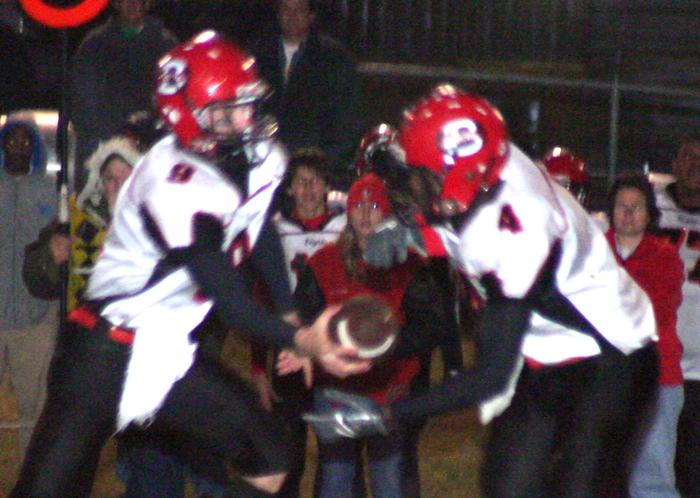 Brighton's Shiler Smith makes a handoff to Deundre Williams.