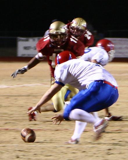 Paul Boykin, #11, takes advantage of a Falcon punting error setting up a Warrior TD.  Also picture is Hunder Davis, #24.