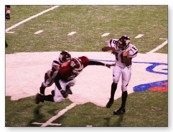 Trojan defender attempts to make a play