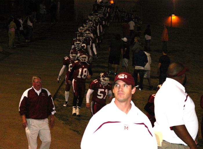 Prior to kickoff, Wayne Randall leads the Region 7-4A Champions onto the field.