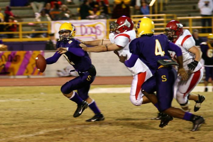 Justin Duncan reaches for Sonny Gray