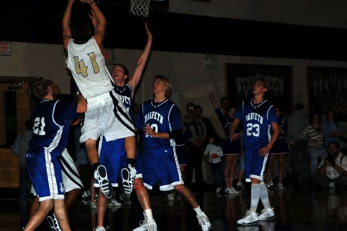 War Eagle's Travis Dempsey elevates for a shot against  Indian Scott Newton
