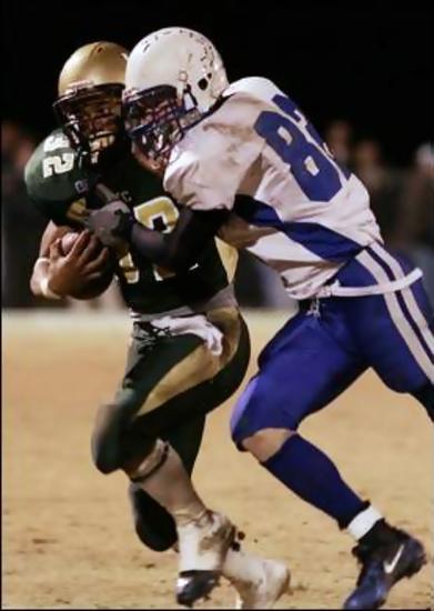 #82 Jonathan Lyons attempts to stop Friendship's #32