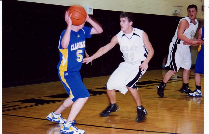 Clay County's Scott Brown guards Clarkrange's Josh Duvall