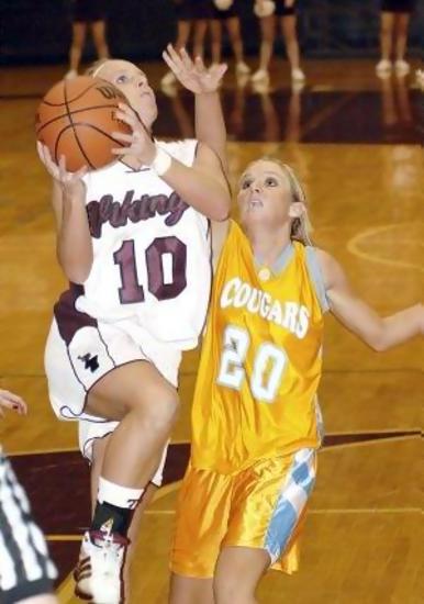 Sullivan Central's #20 Whitney Moody applies pressure as Tennessee High's #10 Jena Rickard tries to drive and lay it in.