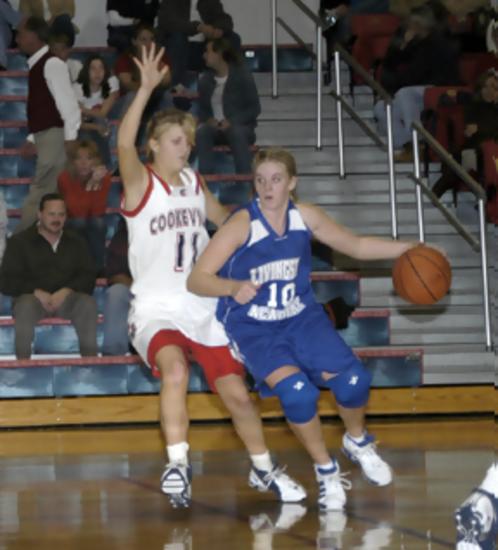 Ashley Matthews drives around defense.