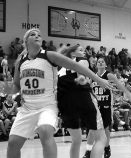 Haley Mullins boxs out her defender.