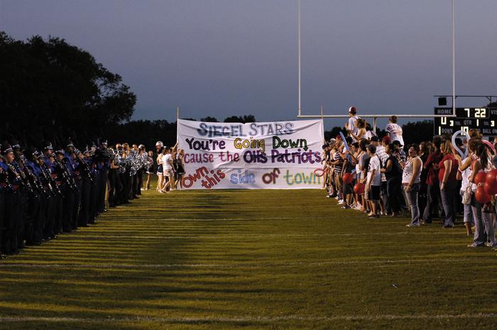The football team gets ready to enter the field for thier game.