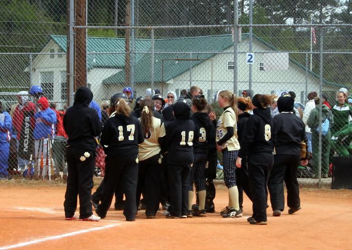 TEAM CONGRATULATES LACEY ON HOME RUN...