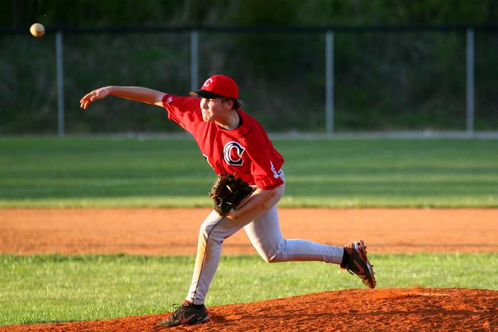 Aaron Pearson throws in the late afternoon sun