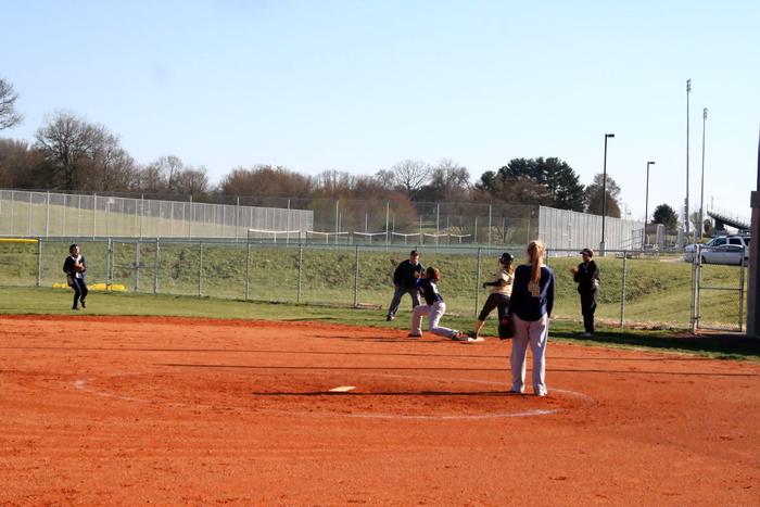 HANNAH RUNNING TO FIRST BASE....