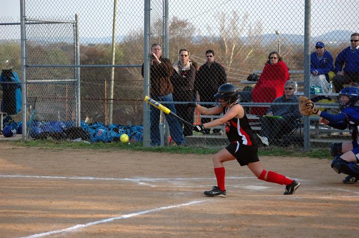 Overton's Sarah Garrett hits the ball.  For more images visit Overton's site at www.johs.org.
