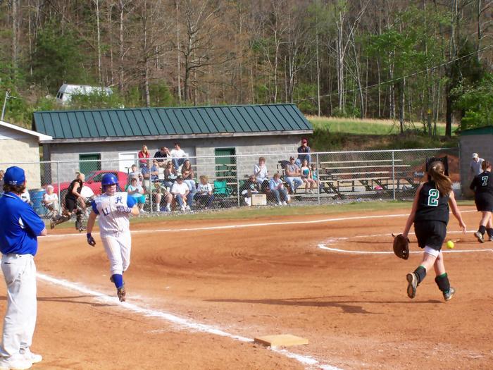 Pitcher Kayla Turner heads for first base.